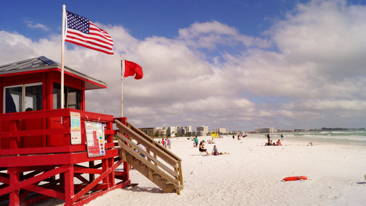 Red lifeguard stand on the white quartz sand of Siesta Key Beach