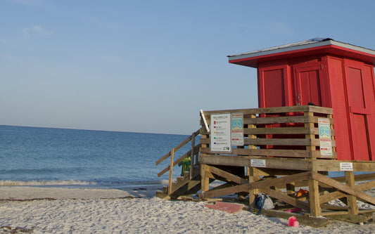 Red lifeguard stand on a white sand Sarasota beach