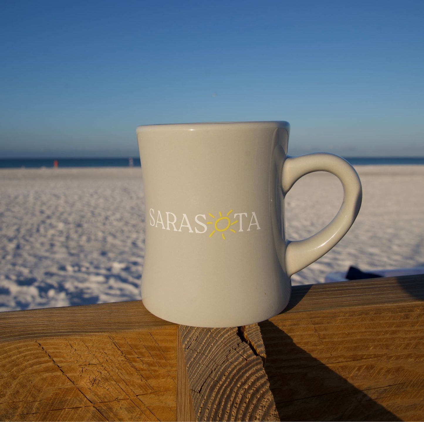 Sarasota Coffee Mug with sun logo
